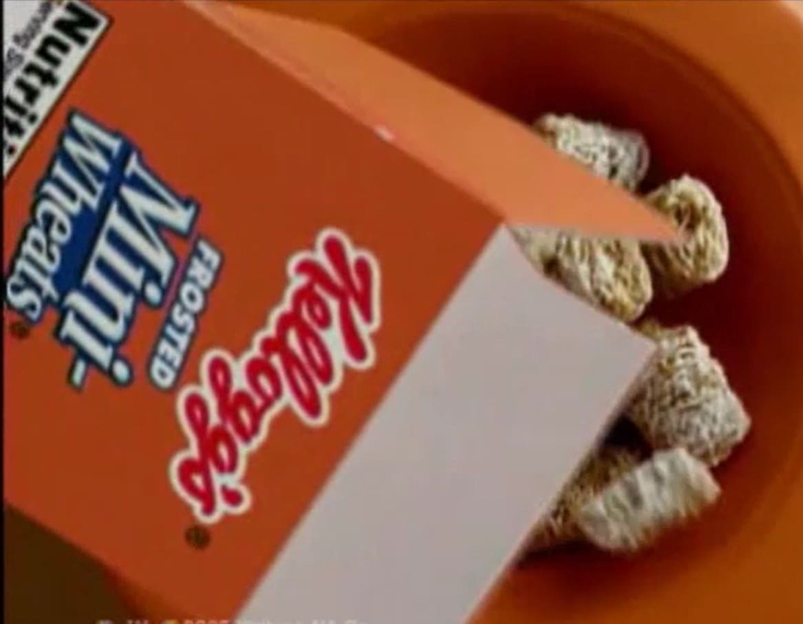 A box of candy is sitting in the bowl.