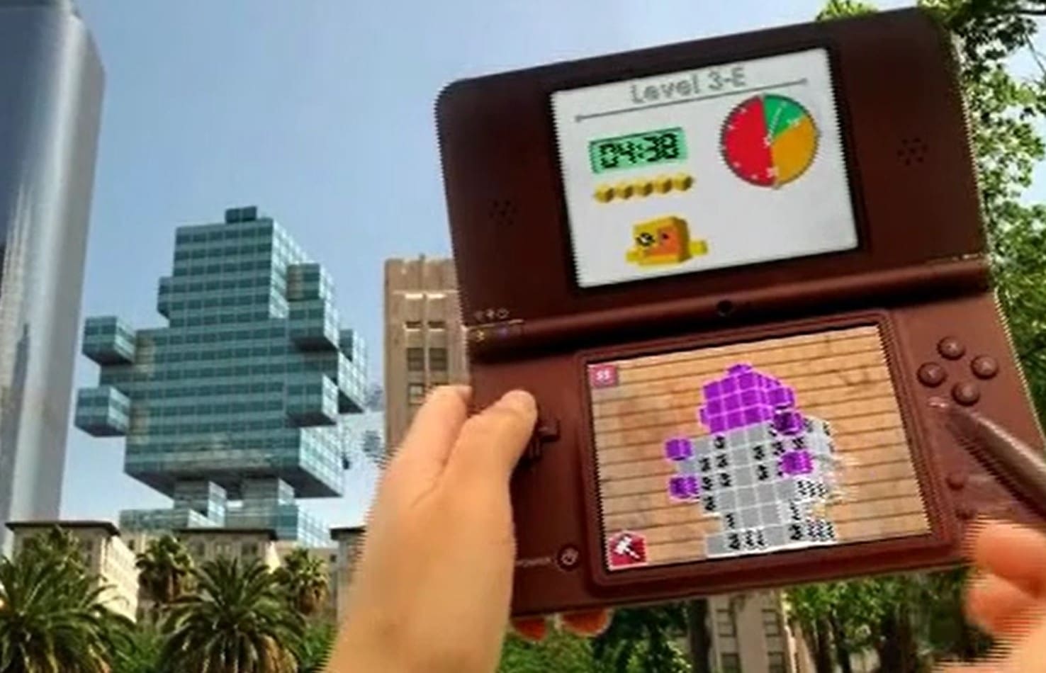 A person holding up a nintendo ds game.