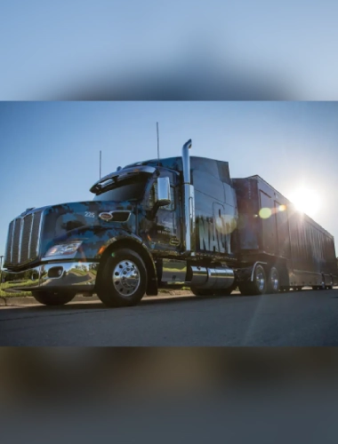 A large truck is parked on the side of the road.